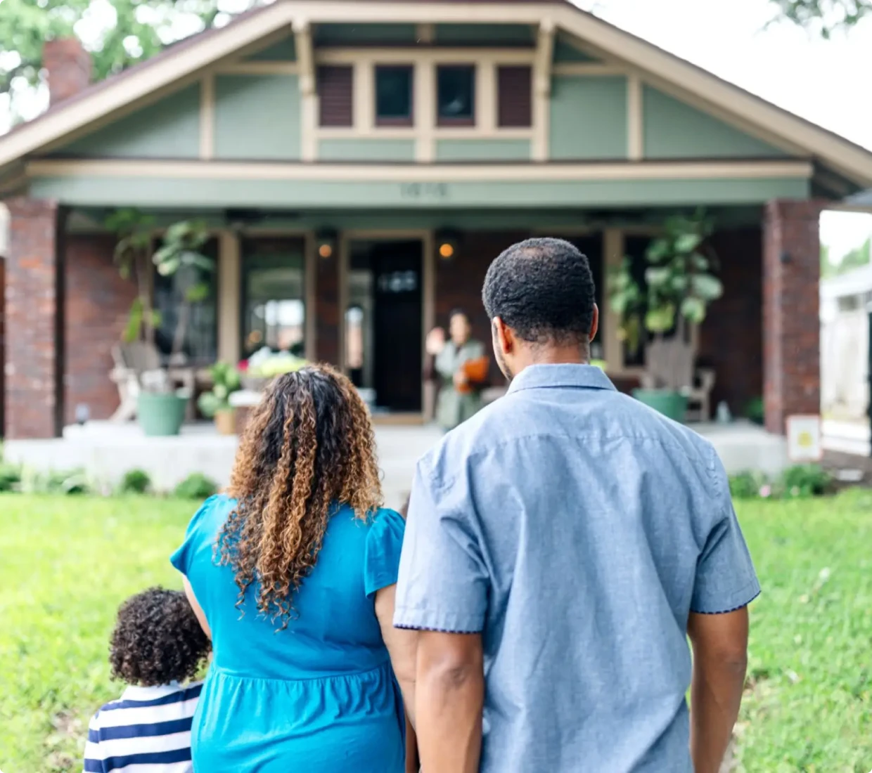 Family approaching their new home